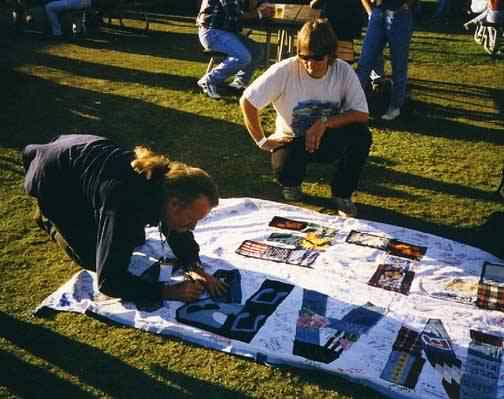 Larry signs the banner